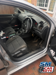 Volkswagen Golf interior showing ignition lock repair completed by SM Car Keys mobile auto locksmith.