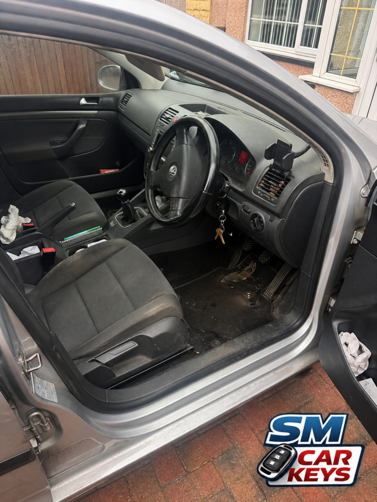 Volkswagen Golf interior showing ignition lock repair completed by SM Car Keys mobile auto locksmith.